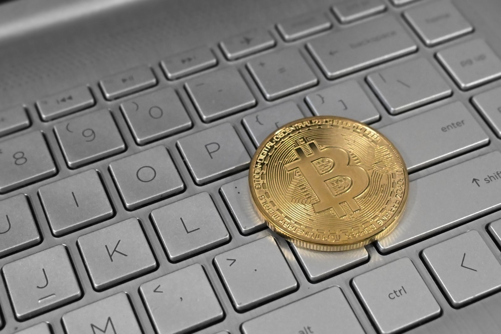 File:Bitcoin on Laptop Keyboard.jpg